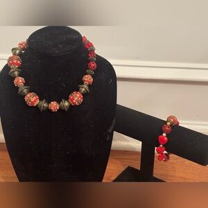 Handmade red and gold beaded necklace and matching bracelet with red hearts